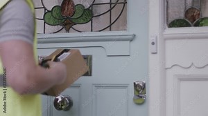 Delivery man delivering parcel at home