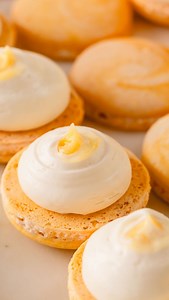 Luscious coconut ganache tastes as good as it looks!!! I had so much fun creating these coconut pineapple macarons. This is one of 5 BONUS recipes for those who pre-ordered my macaron cookbook. It’s available to download immediately after the purchase!! Have you pre-ordered my book yet? #coconutmacarons #coconutpineapplemacarons #macarons #frenchmacarons #coconutganache #pineapplecurd #macaron | Sweet & Savory