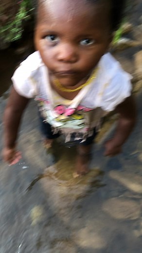 Toddler Playing in Stream: Joyful Outdoor Exploration