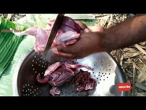 Two full pigeon meat roast cooking in traditional way by village boys. riverside jungle cooking.