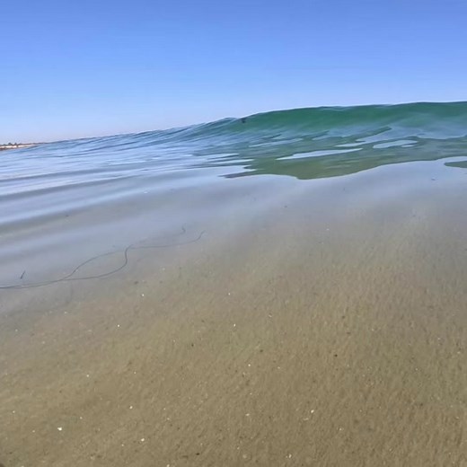 Serene Beach Waves and Clear Ocean Views