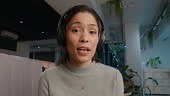 Headphones, virtual meeting and face of woman in conversation in...