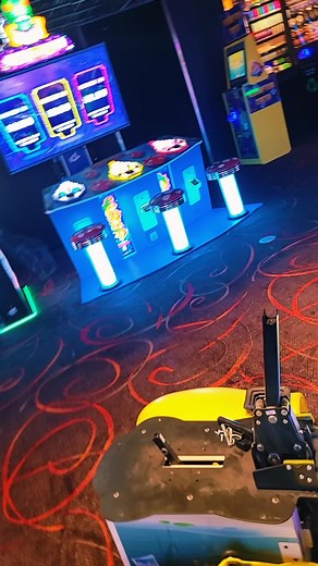 Colorful Arcade Machines Showcase in Vibrant Setting