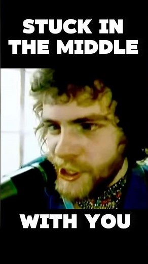 “Stuck in the Middle with You” by Stealers Wheel 🎶