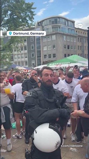 English fans sing to German police officer who looks like Southgate