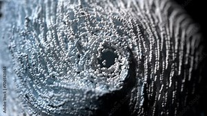 3d render of abstract art video animation of surreal twisted swirl rotating substance as funnel based on small balls spheres particles in blue and white mix color with depth of field effect