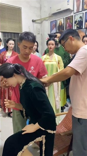 A wax sculptor's daily work: adjusting the head of a wax figure.