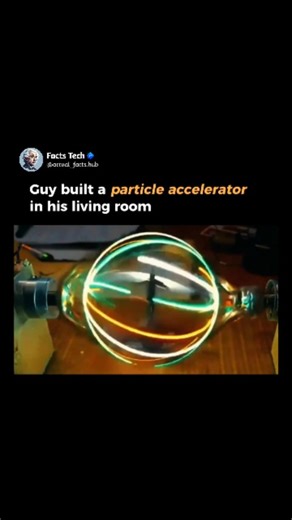 Facts Tech on Instagram: "A cluttered living room has been transformed into a mini science lab, with coils, vacuum tubes, and glowing wires arranged in a circular setup. In the center, a homemade particle accelerator hums quietly, proving that high-energy physics doesn’t always need a billion-dollar facility—just curiosity and determination. Between a sofa and a bookshelf, a DIY particle accelerator spins charged particles through metal rings and magnets. The contrast between everyday furniture 