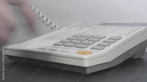 Phone in the hotel room. A landline telephone in a hotel or office for communication with employees, room service. Close-up