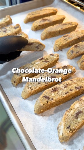 Don’t be deceived by its humble appearance; this mandelbrot is a spectrum of holiday flavors in one cookie. “Almond bread” in Yiddish, it spruces up nicely with all kinds of spice and chunky mix-ins. In this case, we’re adding cinnamon, orange zest, vanilla, almonds, and chocolate chunks—but you could add any nut, dried fruit, citrus, or warming spice. It comes together in minutes in the food processor, and you can make and store up to a week in advance. Our resident baking expert Rose Hattabaug