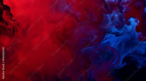 A abstract of vibrant red and blue smoke swirls against a dark backdrop. dynamic hues create an energetic feel, ideal for creative projects or video editing. Stock Video