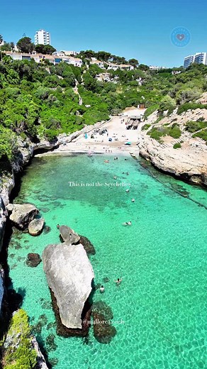 This is . . 👇🏼 . . 📍Cala Antena, Mallorca 🇪🇸 ⭐️ Find the best discounts island-wide for car/boat/yacht rentals & activities on our profile! This is not the Seychelles this is Mallorca and Cala Antena is one of those secret beaches in Spain that makes you wonder if you are really still in Europe. The crystal-clear turquoise sea sparkles between rocky cliffs, and the unique stones rising from the water look just like the famous granite rocks of the Seychelles, but here they blend with the gol