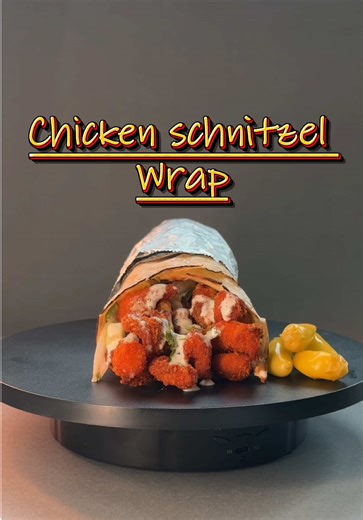 Crispy. Juicy. Life-changing.😎 This Chicken Schnitzel Wrap is the kind of meal that makes you forget you ever considered ordering from that sad chain place down the street. Golden-fried chicken schnitzel packed with fresh veggies, perfectly seasoned and wrapped tight. It's comfort food that actually tastes like it was made with love, not by a machine at 2 AM. Wednesday lunch? Thursday night dinner? Friday wind-down? Late-night cravings? This wrap handles all of it. No cooking, no mess, no regre