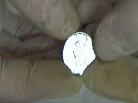Use chemistry to remove the copper plating on a penny