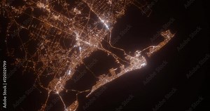Atlantic City (New Jersey, USA) aerial view at night. Top view on modern city with street lights. Camera is zooming out, rotating clockwise