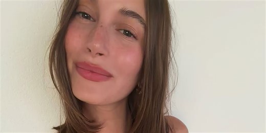 Hailey Bieber's Plunging Cheetah-Print Swimsuit Has a Lace-Up Cutout Revealing Her Entire Midsection