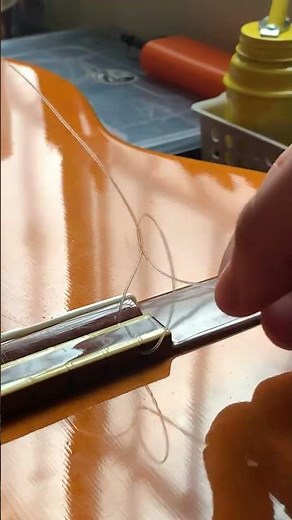 How do you strings a classical guitar? #guitarlesson
