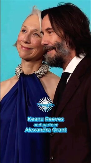 Keanu Reeves and Alexandra Grant share a kiss at the event.