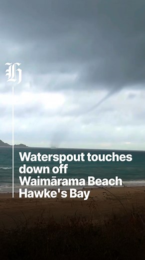 Sarah Jayne Curd captured the rare moment near Bare Island during stormy weather at the popular Hawke's Bay beach. Video / Sarah Jayne Curd | nzherald.co.nz
