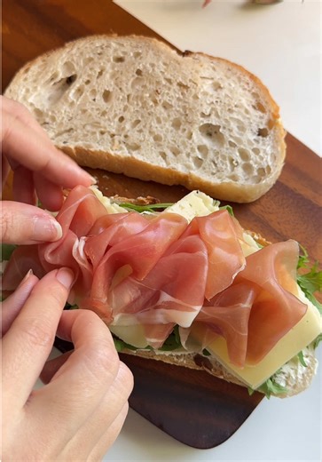 Grilled Cheese Sandwich ~ Sourdough @lostinsweet ~ Cream cheese ~ Sun-dried tomato pieces ~ two slices of cheese ~ Jamón (Dry-cured ham)