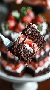 Strawberry Chocolate Stack Cake Moist chocolate layers, fresh strawberries, whipped cream, and warm ganache dripping down every side. Ingredients: Chocolate Cake Layers: 2 cups all-purpose flour ¾ cup unsweetened cocoa powder 1¾ cups sugar 2 tsp baking soda 1 tsp baking powder ½ tsp salt 2 eggs 1 cup buttermilk ½ cup neutral oil 1 cup hot brewed coffee 1 tsp vanilla extract Filling: 2 cups heavy cream 4 tbsp powdered sugar 1 tsp vanilla 2 cups sliced strawberries Chocolate Ganache: 1 cup chocola