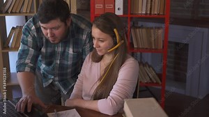 System Administrator and Girl Manager. Computer Engineer Specialist Communicates With Client. Senior Manager Teaches Woman. Distance Working. Computer Support Service. Software Using. Laptop Computer.