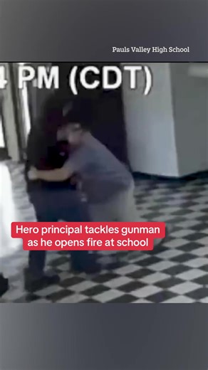 This is the jaw-dropping moment a hero principal tackles a school shooter preparing to open fire on students. Read the full story above. #schoolshooting #principal #heroicvideo #truecrime