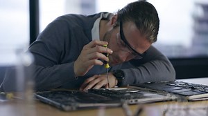 Hardware, maintenance and laptop with man | Premium Stock Video Footage