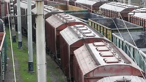 Freight train with wagons full of grain as cargo transportations moving from railway station