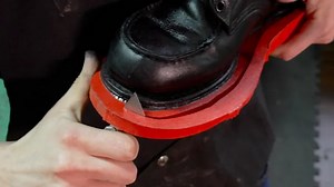 Leatherworker revives Red Wing boots with new sole and dye job