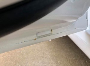 This Image Alleges Evidence of Rust on a Tesla Model 3 Door