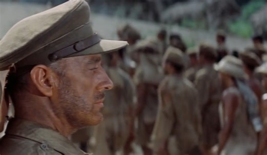 Mitch Miller - March From The River Kwai And Colonel Bogey (1957) "March from The River Kwai and Colonel Bogey," masterfully produced by Mitch Miller, combines Lieutenant F.J. Ricketts's "Colonel Bogey March" (1914) with Malcolm Arnold's composition for the 1957 film "The Bridge on the River Kwai." This medley, under Miller's direction, transcended its military march origins, embodying resilience and defiance. The film's story of British POWs in Burma, paired with its memorable score, resonated 