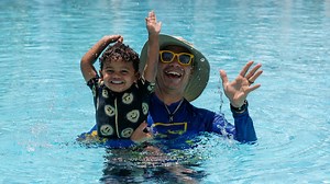 Teaching a 2-year-old child swimming