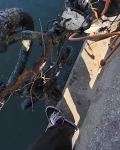 We were magnet fishing, and Jeff pulled up a motorcycle frame, but the serial number area looked chopped 😳 Then it got even weirder… we snagged what looks like a mini pit bike, an old fan motor, random gears, and a bunch of recliner-looking metal buried in thick mud. Just when we thought we were done, we hooked a giant bent hook tangled in a heavy casting net… and even another bicycle came up #magnetfishing #danidip #treasurehunting | Dani Dip