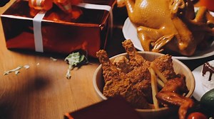 Download A table with a turkey, chicken, and other food for free