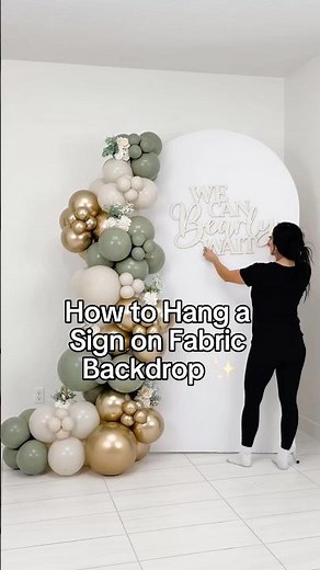 How to Hang a Wooden Sign on Fabric Backdrop