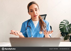 Woman Doctor Home Medical Uniform Stethoscope Sitting Table Laptop Talking