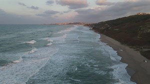 Sea waves covering a beach seen from above - Free Stock Video