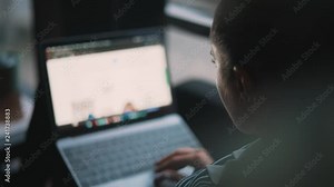 Attractive girl working on her computer in the living room or office. Business woman's hand touching laptop's touchpad. Woman's hands type on keyboard. Surfing internet and use messenger