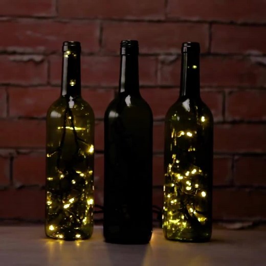 17K views · 193 reactions | Hey wine drinkers, don't know what to do with those extra Christmas lights? All is calm and bright with these gorgeous DIY wine bottle accent lights ✨ --> https://diyprojects.com/empty-wine-bottles-accent-lights/ | DIY Projects | Facebook