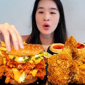 In Singapore eating KFC's new Butter Cereal Chicken! Also enjoying the Cheesy Zinger Stacker Burger and new Lychee Egg Tarts! Highly recommned the Cereal Chicken if you have the chance to try it! #mukbang #asmr #kfc #singapore #friedchicken #crispy #eatingsounds | Peggie Neo