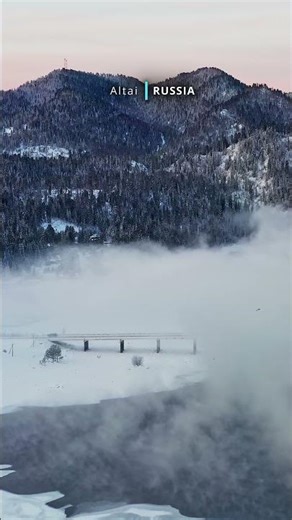 Aerial cinematic view of snow covered beautiful Altai