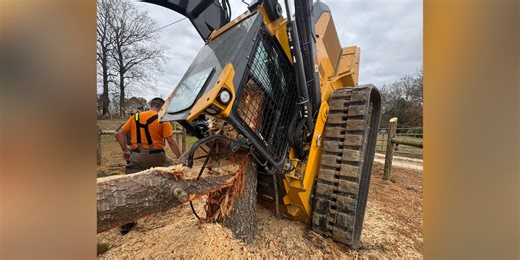 Man ‘miraculously’ survives being pinned in track loader by large tree trunk
