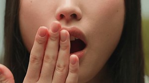 Unrecognizable scared girl Asian chinese korean woman female student lady shocked amazed lady wonder surprise wow news open mouth cover hand fear reaction shock emotion stunned face details close up