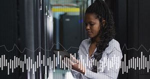 Animation of graphs and data over african american woman in server room. network, programming, computers and technology concept digitally generated video.