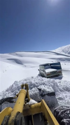Clearing 2 meters of snow with a front loader.