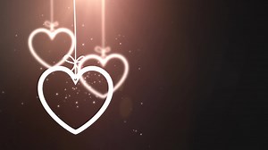 Download paper valentine hearts falling down hanging on string black background for free