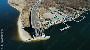 Architectural structure drawbridge with raised part across river. Concept of logistics of roads and waterways