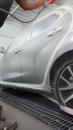 Professional Car Painting Process in an Automotive Workshop