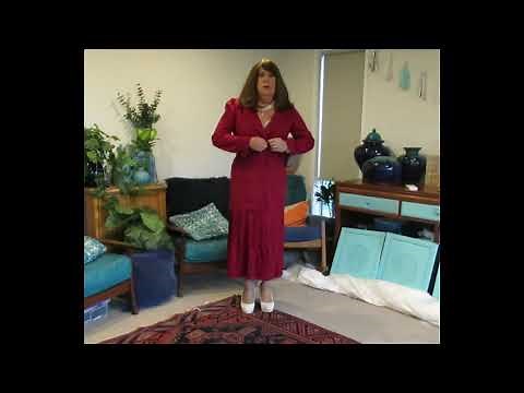 Putting on a lovely dress crossdreser